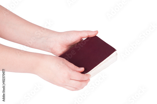 Male hand holding a book isolated
