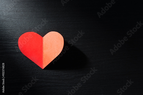 red hearts isolated on wooden background