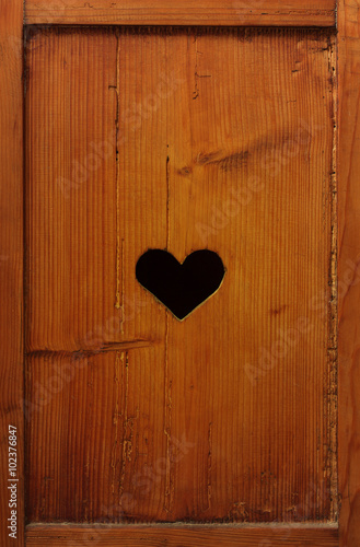 Valentines day card design of wood and heart shaped hole