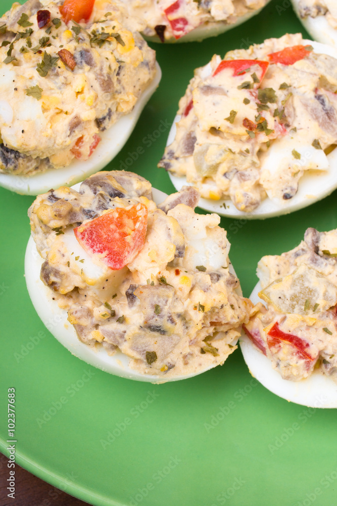 stuffed eggs with peppers, mushrooms and herbs - selective focus stuffed eggs with peppers, mushrooms and herbs - selective focus