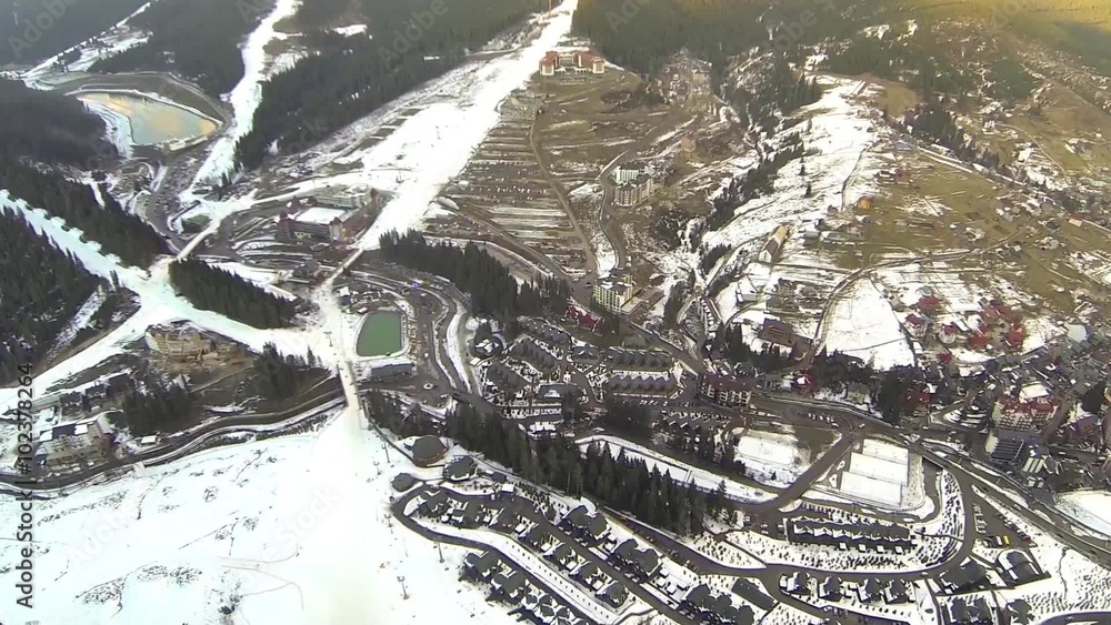 Aerial shot of ski resort Bukovel with snow covered slopes at spring Aerial shot of ski resort Bukovel with snow covered slopes at spring