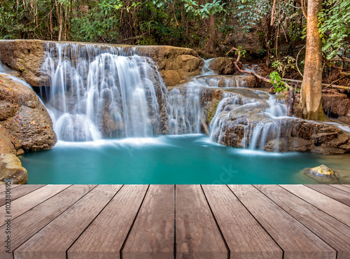 Fototapeta Naklejka Na Ścianę i Meble -  waterfall in deep forest of thailand and wood plank