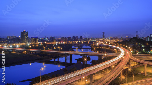 Aerial view of Taipei cityscape with river and highway