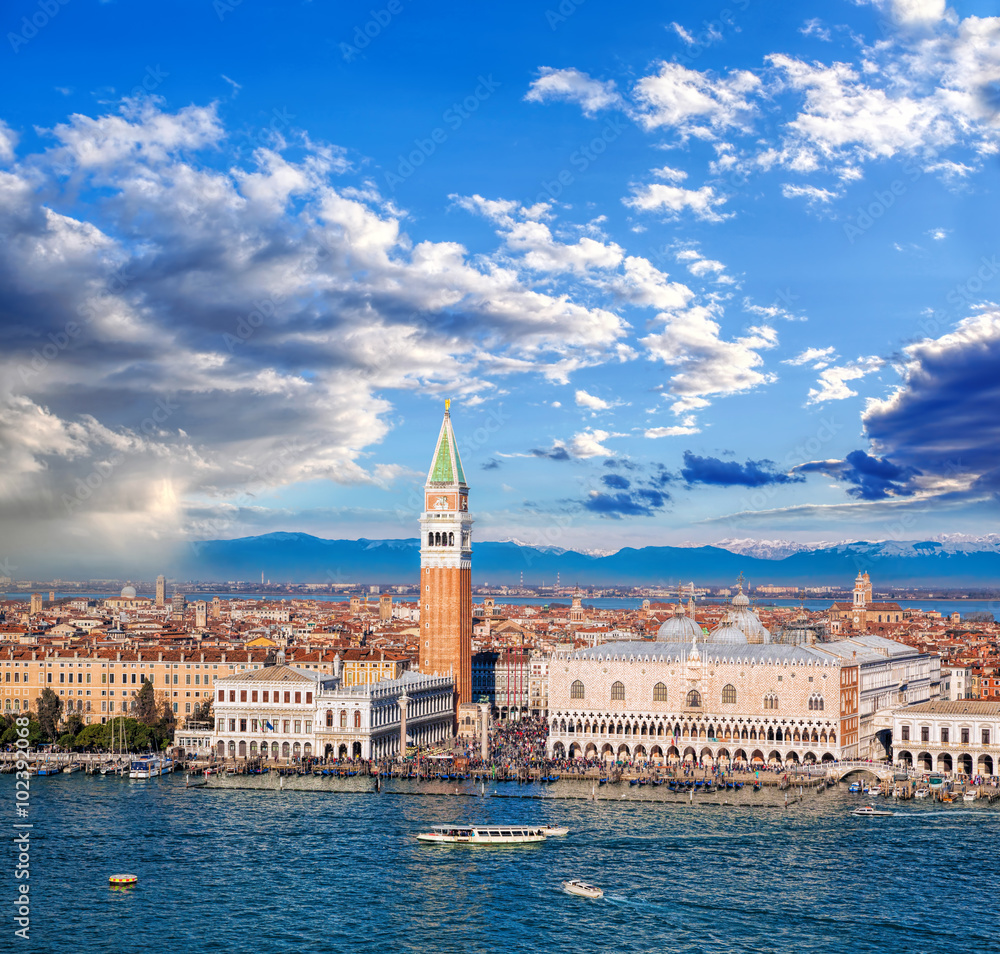 Piazza San Marco with Bell Tower and the Doge Palace against Italian Alps in Venice, Italy