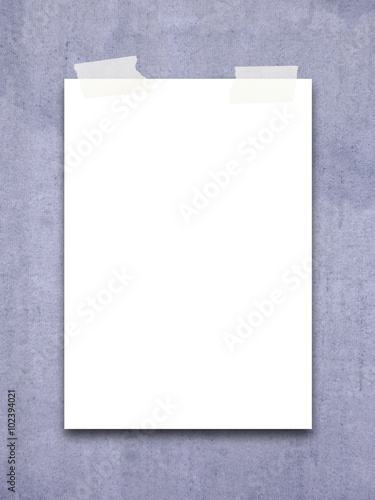 Close-up of one paper sheet frame with adhesive tape on indigo canvas background