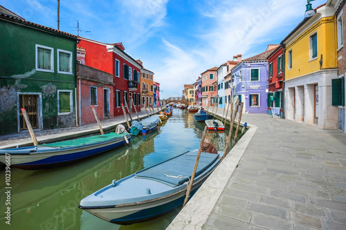 Colorful houses on the famous island Burano, Venice, Italy. © sahachat
