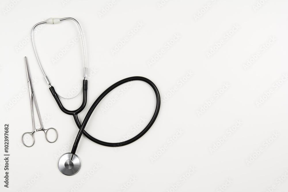 Top view of modern, sterile doctors office desk. Medical accessories on a white background with copy space around products. Photo taken from above. Top view of modern, sterile doctors office desk. Medical accessories on a white background with copy space around products. Photo taken from above.