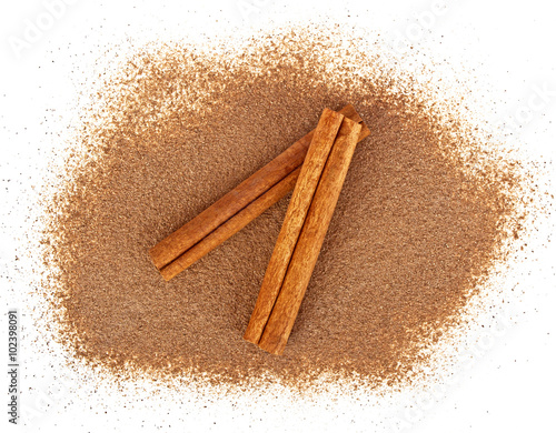 Cinnamon sticks with powder isolated on white background