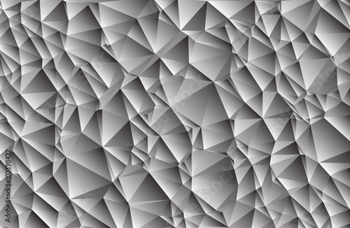 Abstract gray background consisting of triangles. Vector art.