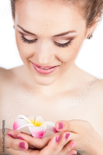Beauty face of young girl with flower