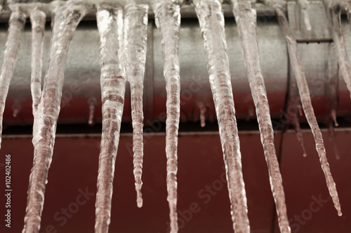 Icicles on the roof. winter cold weather concept