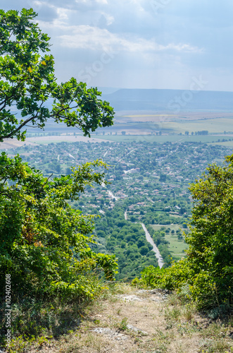 aerial view of bulgarian city madara situated on the shumen plateau and famous for its carving of konnik. photo