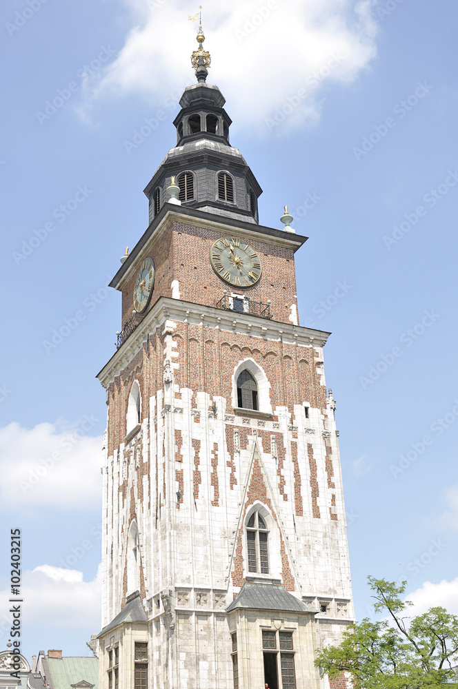 Gothic city hall tower with clock in the Main Market Square of the Old City in Krakow in Poland