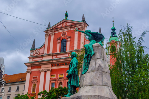 view of a memorial of france presener with the franciscan church of annunciation in slovenian capital ljubljana photo