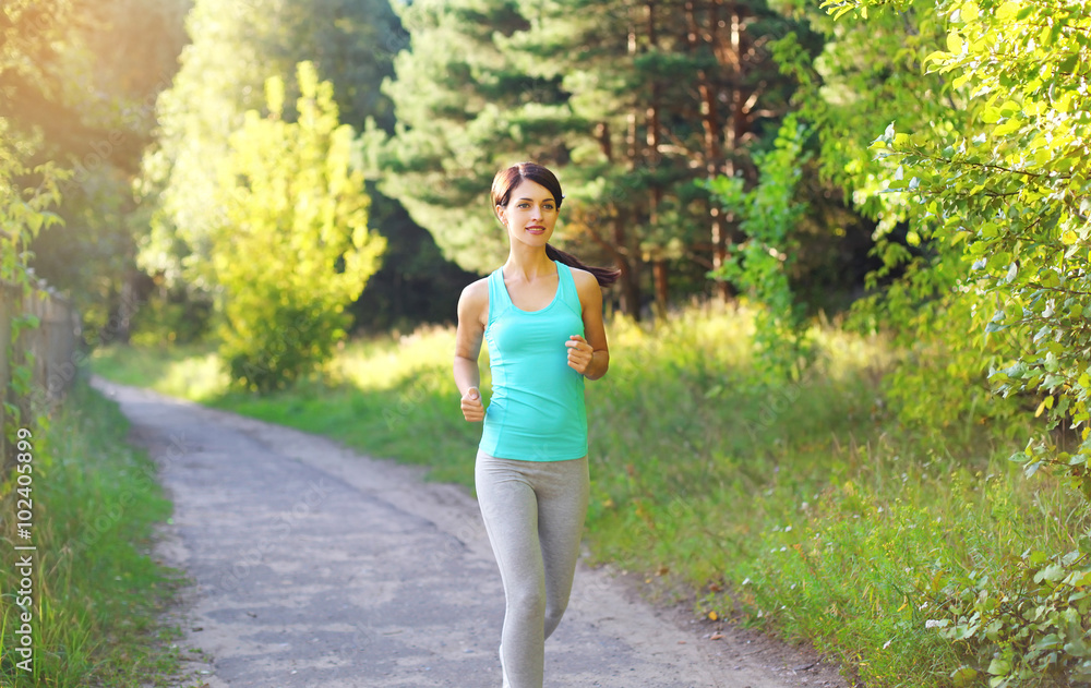 Fitness young woman running in park, female runner workout, spor Fitness young woman running in park, female runner workout, spor