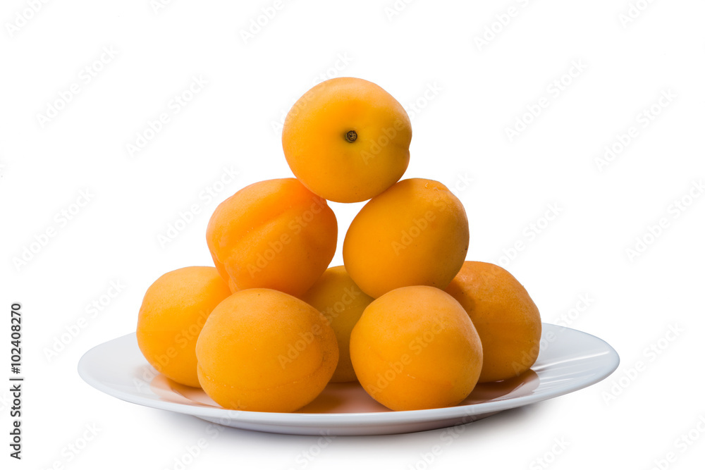 yellow peach slices on plate isolated on white yellow peach slices on plate isolated on white