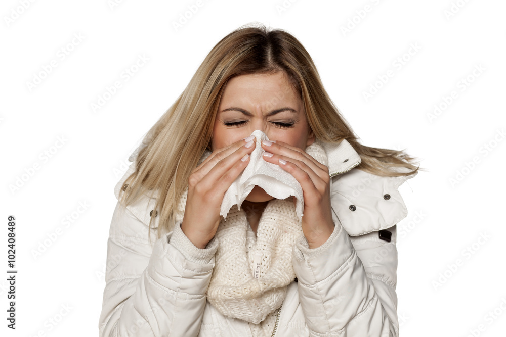 cold young beautiful woman in winter clotes wipes his nose with a handkerchief cold young beautiful woman in winter clotes wipes his nose with a handkerchief