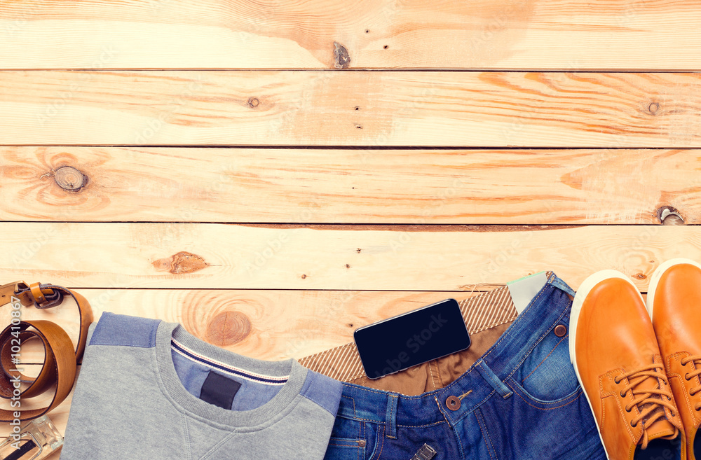 Men's casual clothes on wooden background Men's casual clothes on wooden background