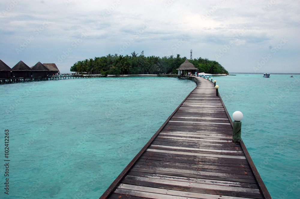 Timber pier at Maldives island resort