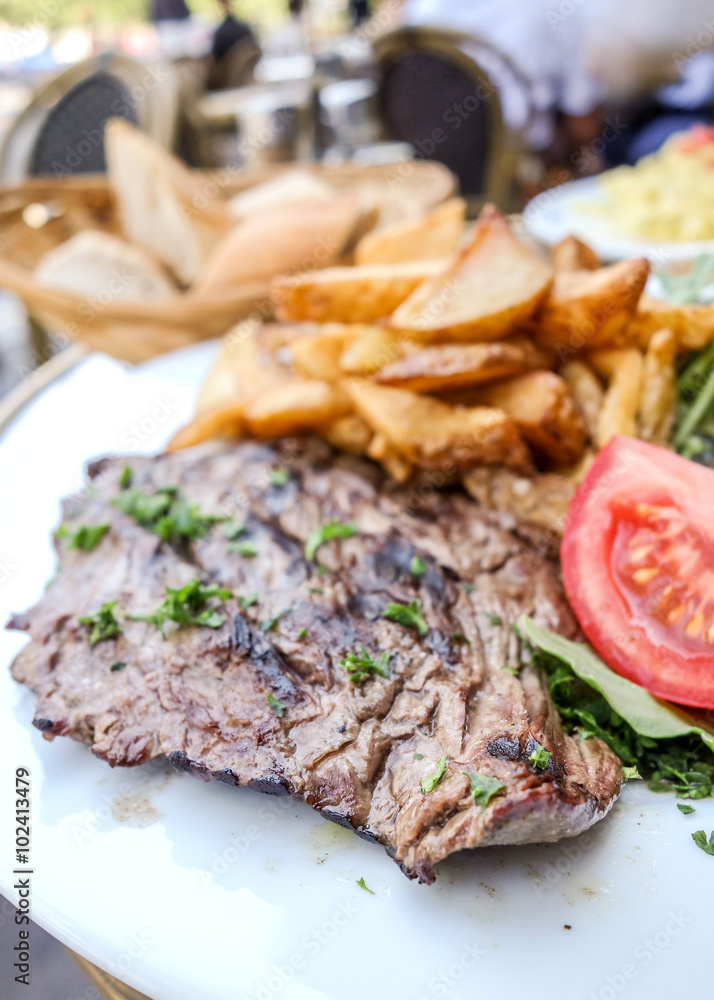 juicy steak beef meat with tomato and french fries