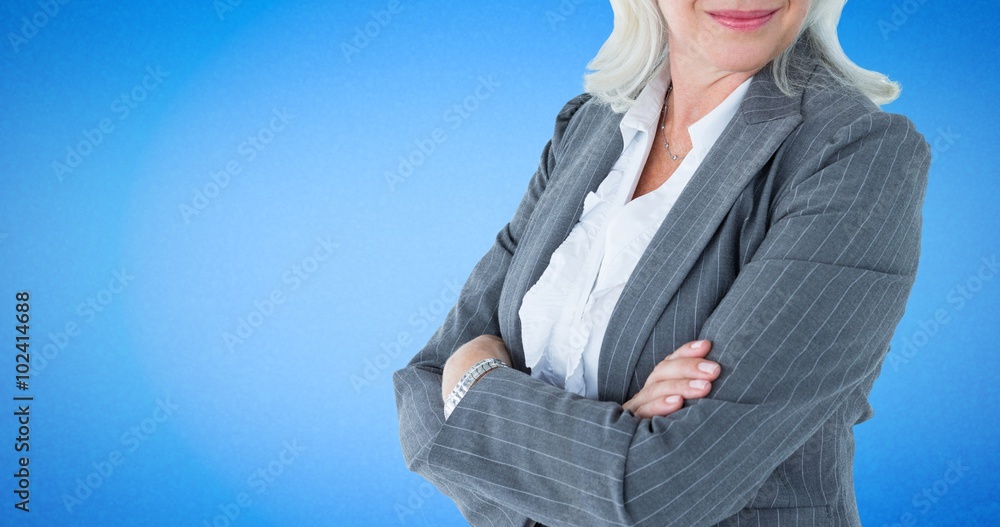Composite image of businesswoman standing arms crossed Composite image of businesswoman standing arms crossed