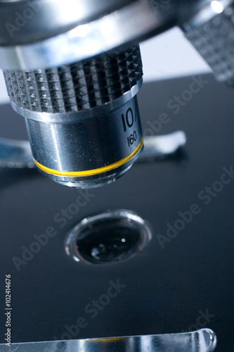 Closeup of a microscope objective (with focus on the objective, shallow DOF)
