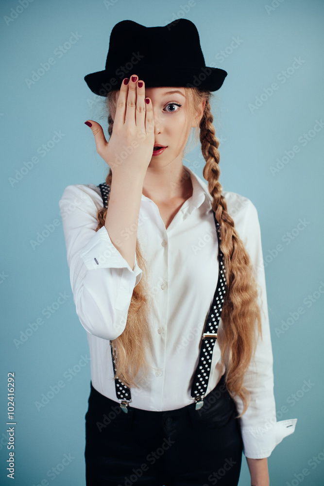 Smiling girl with long blonde hair on blue background Smiling girl with long blonde hair on blue background
