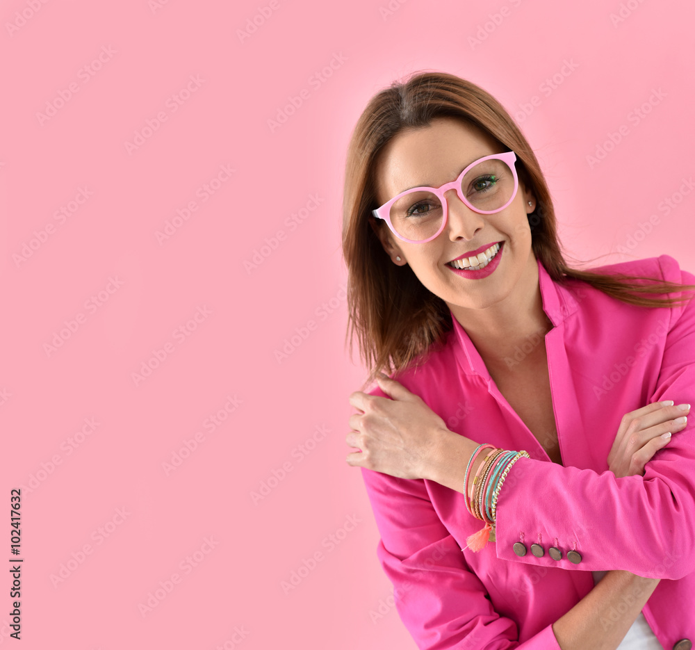 Cheerful girl wearing eyeglasses, pink color Cheerful girl wearing eyeglasses, pink color