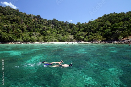 Couple snorkeling with clear water at Lipe island, Thailand