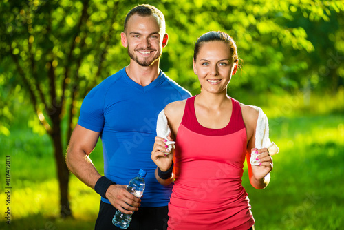 Fototapeta Naklejka Na Ścianę i Meble -  Athletic man and woman after fitness exercise