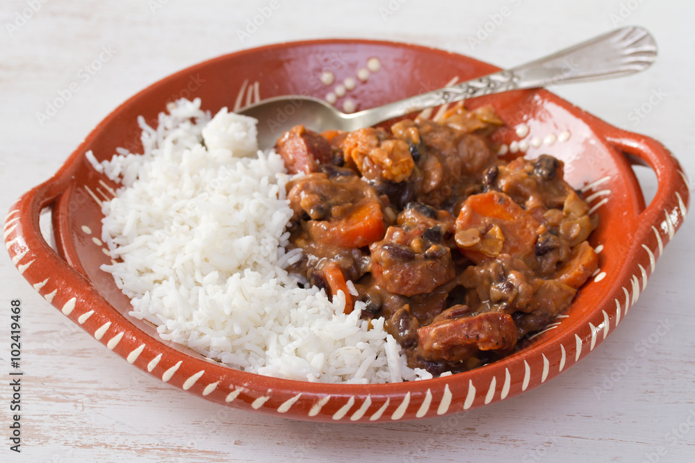 typical portuguese dish feijoada with rice in ceramic bowl typical portuguese dish feijoada with rice in ceramic bowl