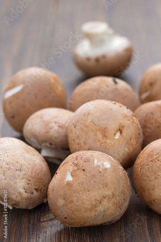 mushrooms on brown wooden background