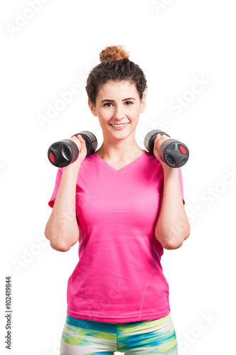 Female workout with dumbbells in the gym