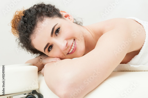 Beautiful and healthy woman relaxing in spa salon