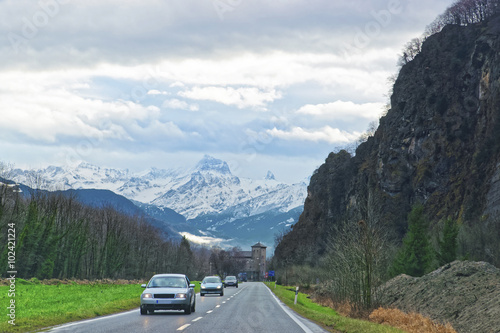 Road view to castle and mountains in Switzerland