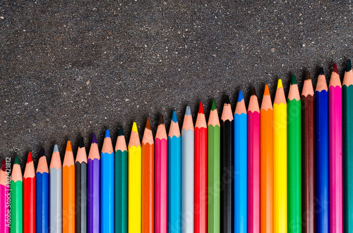 Colorful pencils on dark table photo