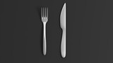 Fork and knife, isolated on black background.