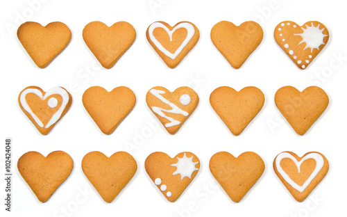 Heart shaped cookies pile isolated over white