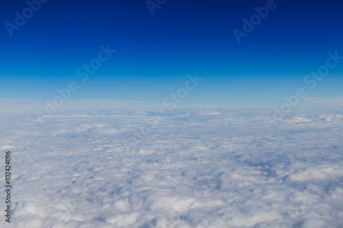 Blue horizon and white clouds, aerial shot © viperagp