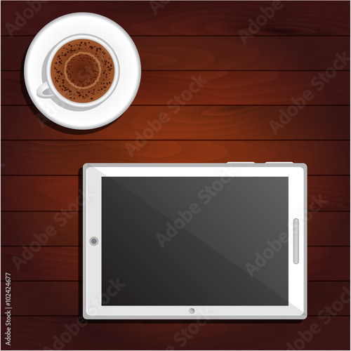 Cup of cappuccino and white tablet on table