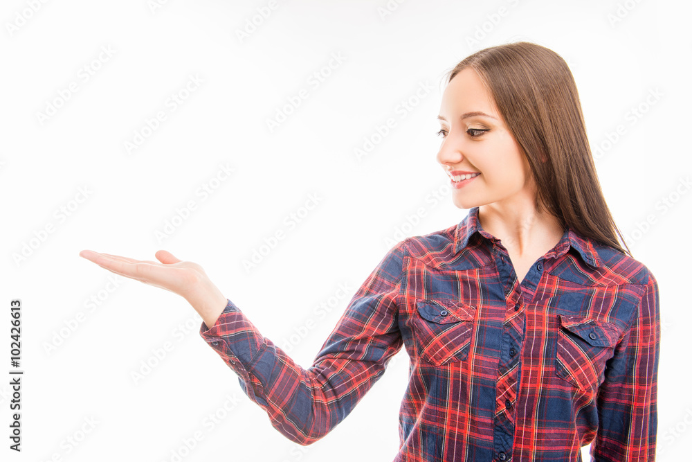 Smiling woman showing a product, photo with copy space Smiling woman showing a product, photo with copy space