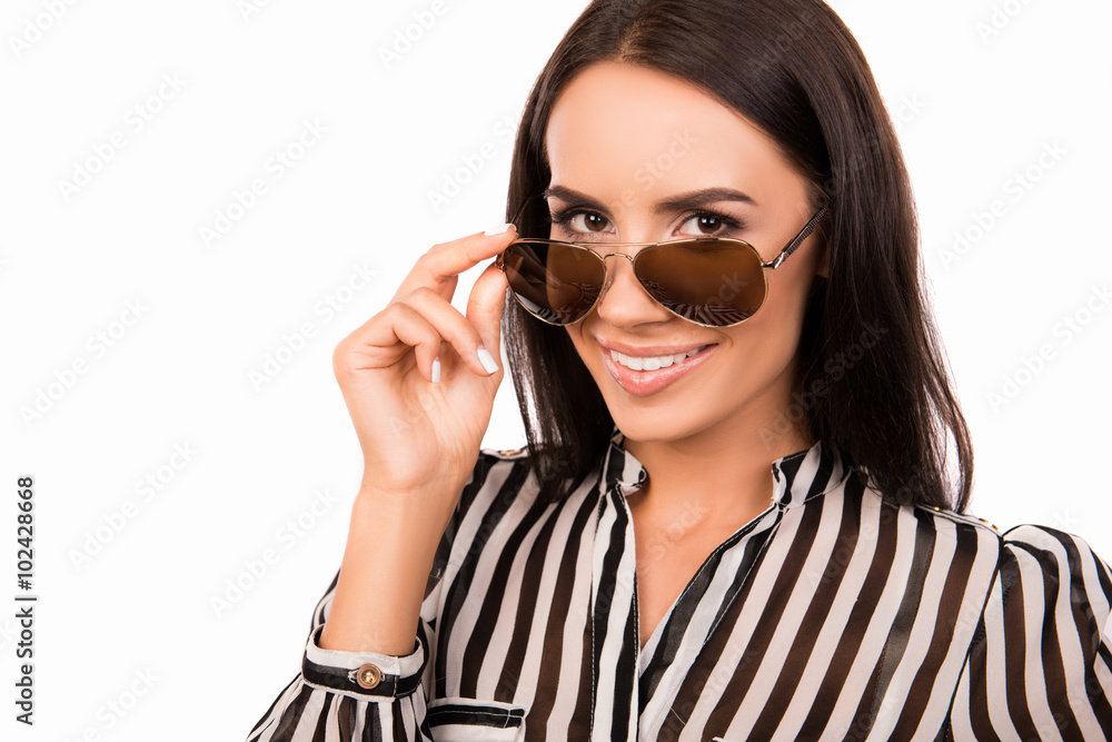 Close up portrait of trendy young smiling woman touching her spe Close up portrait of trendy young smiling woman touching her spe