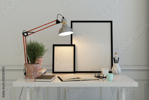 Obraz na płótnie Empty picture frames on a writing desk