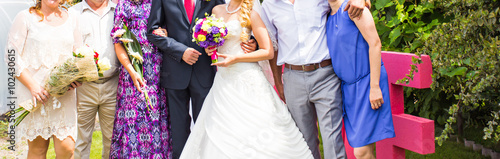 Slika na platnu Wedding guests with bride and groom
