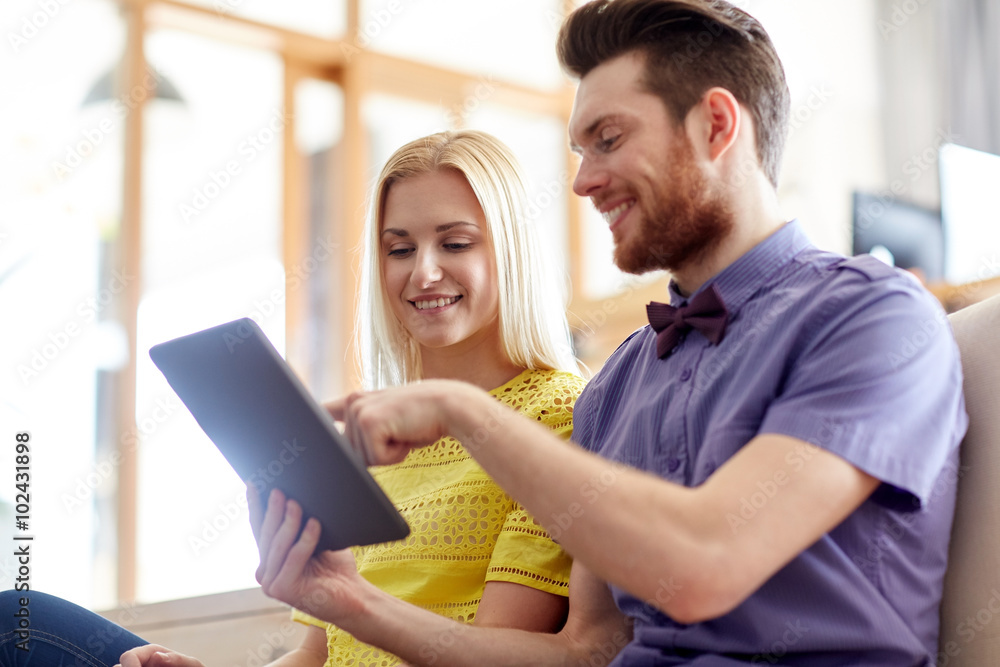 happy creative team with tablet pc in office happy creative team with tablet pc in office