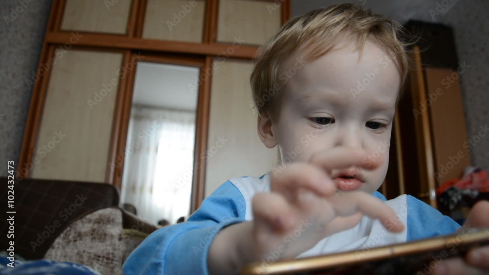 little boy playing with mobile phones little boy playing with mobile phones
