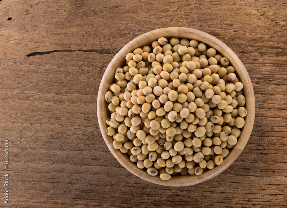 Soy beans in a wooden bowl Soy beans in a wooden bowl