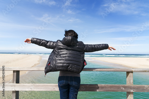 woman in the seafront watching the atlantic  beach in Razo, Spai photo