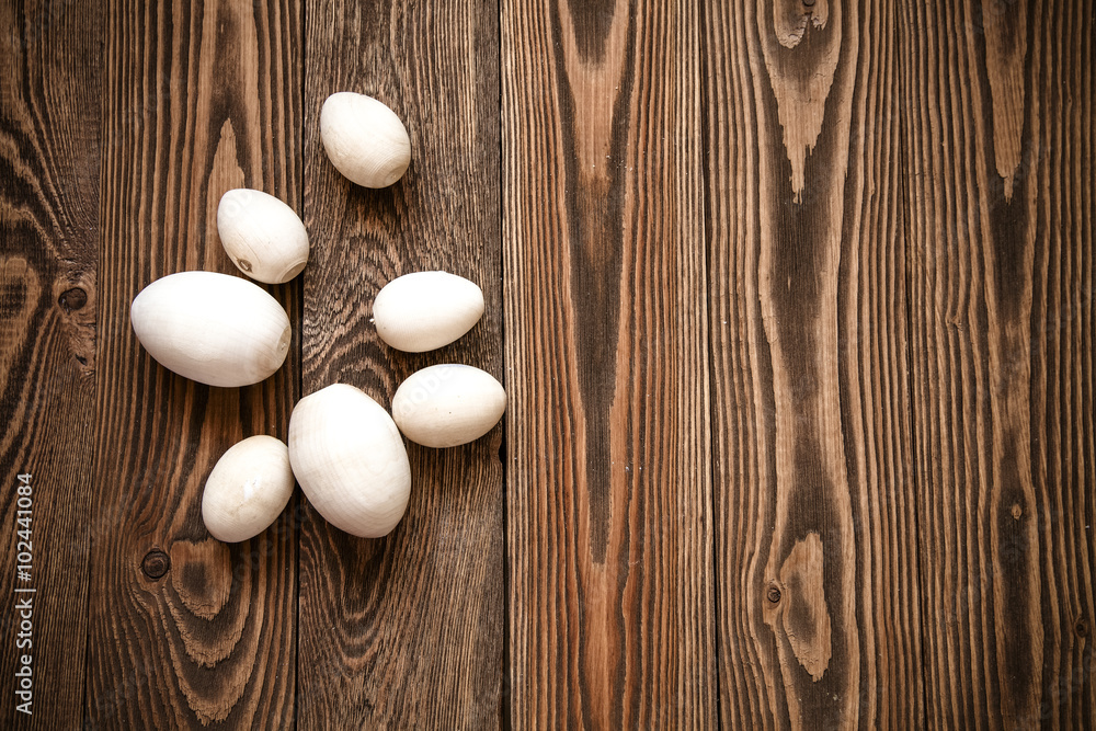 Wood toy eggs on brown wood background, board, texture, Wood toy eggs on brown wood background, board, texture,