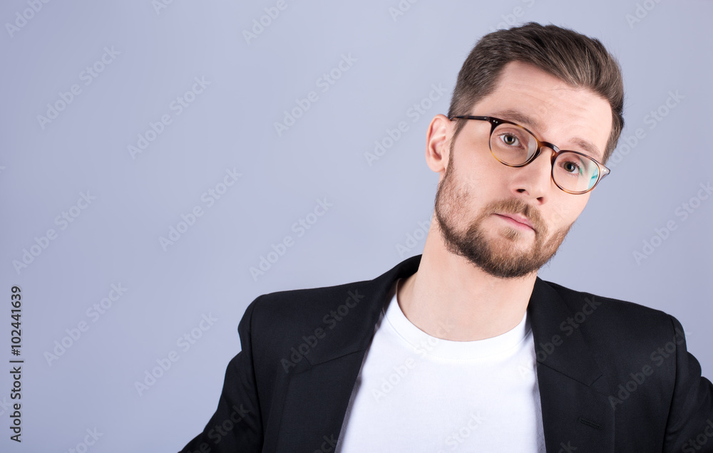 Young guy with a beard and mustache with glasses, looking at cam Young guy with a beard and mustache with glasses, looking at cam